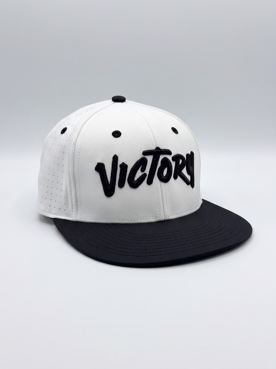 White Victory Softball cap with black brim and raised black Victory brush-script embroidery